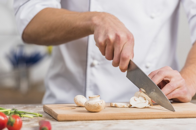chef knife cutting garlic